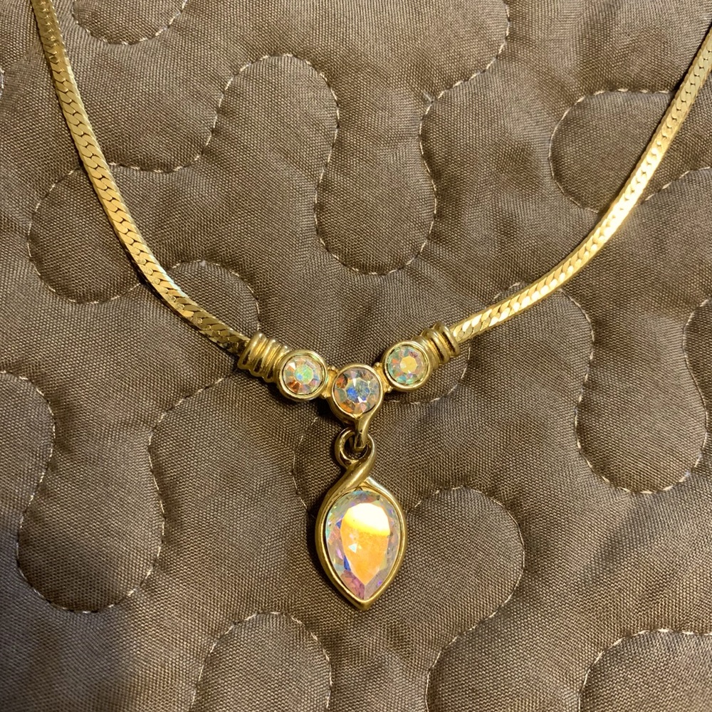Gold necklace with iridescent stones